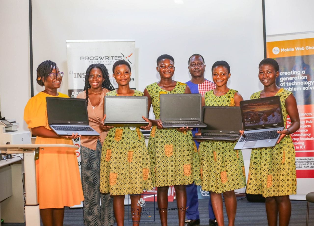 Young people in Ghana with laptops at a Proswrites Foundation event